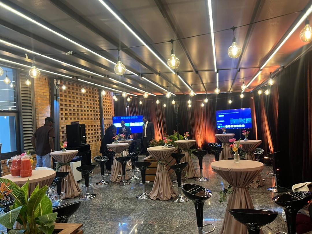 Cocktail lounge with bar stools, high tables and string lights