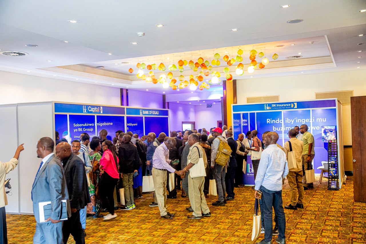Visitors flowing through branded exhibition booths at a hotel hall