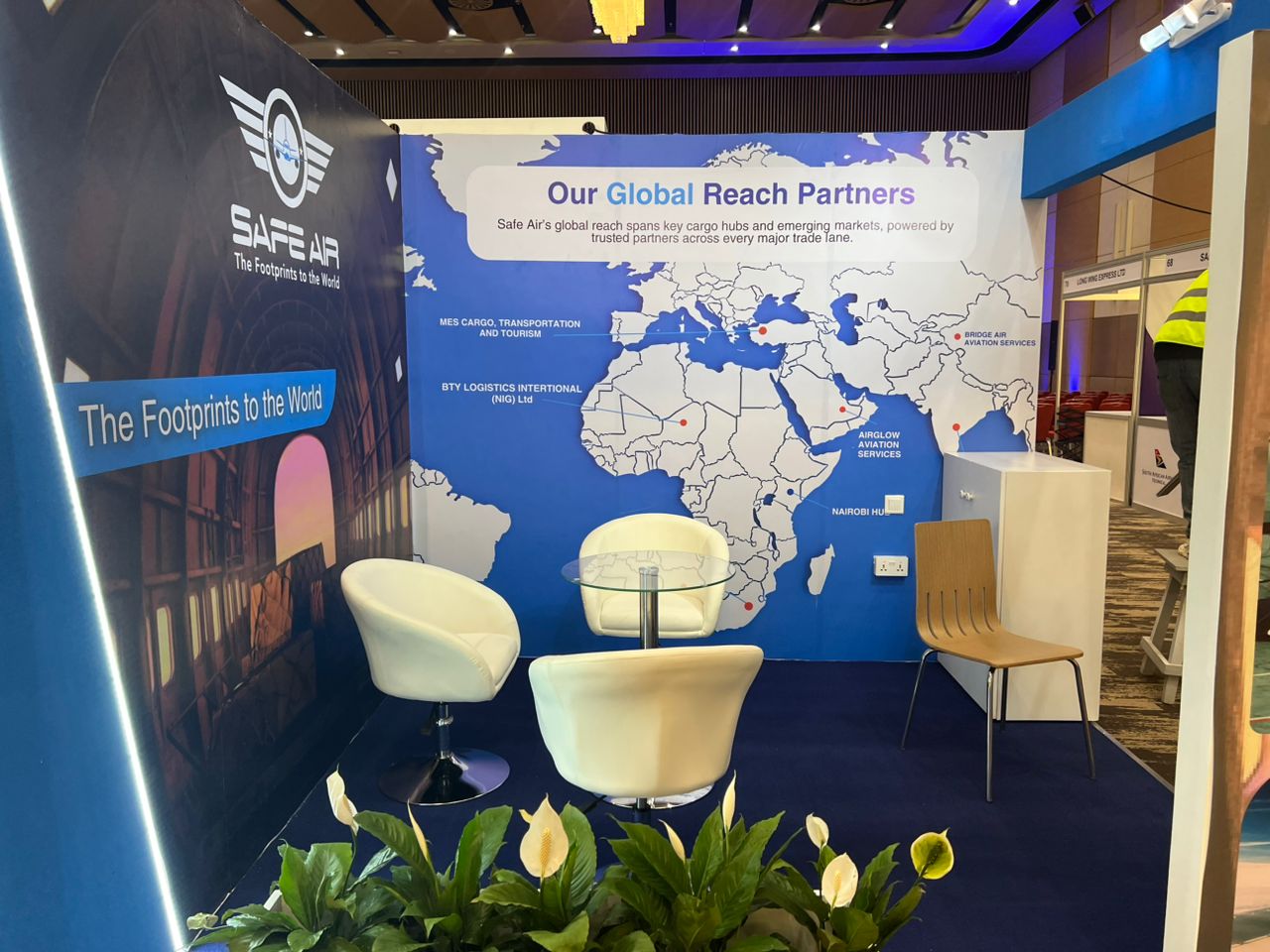 Safe Air custom exhibition stand with printed walls and lounge seating