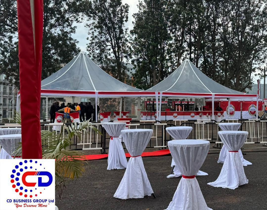 Transparent pagoda tents with Amstel-branded bar and dressed cocktail tables at Kigali Convention Events Village